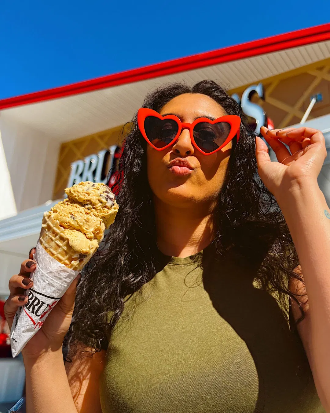 A customer enjoying a Bruster’s cone outside the Annapolis shop